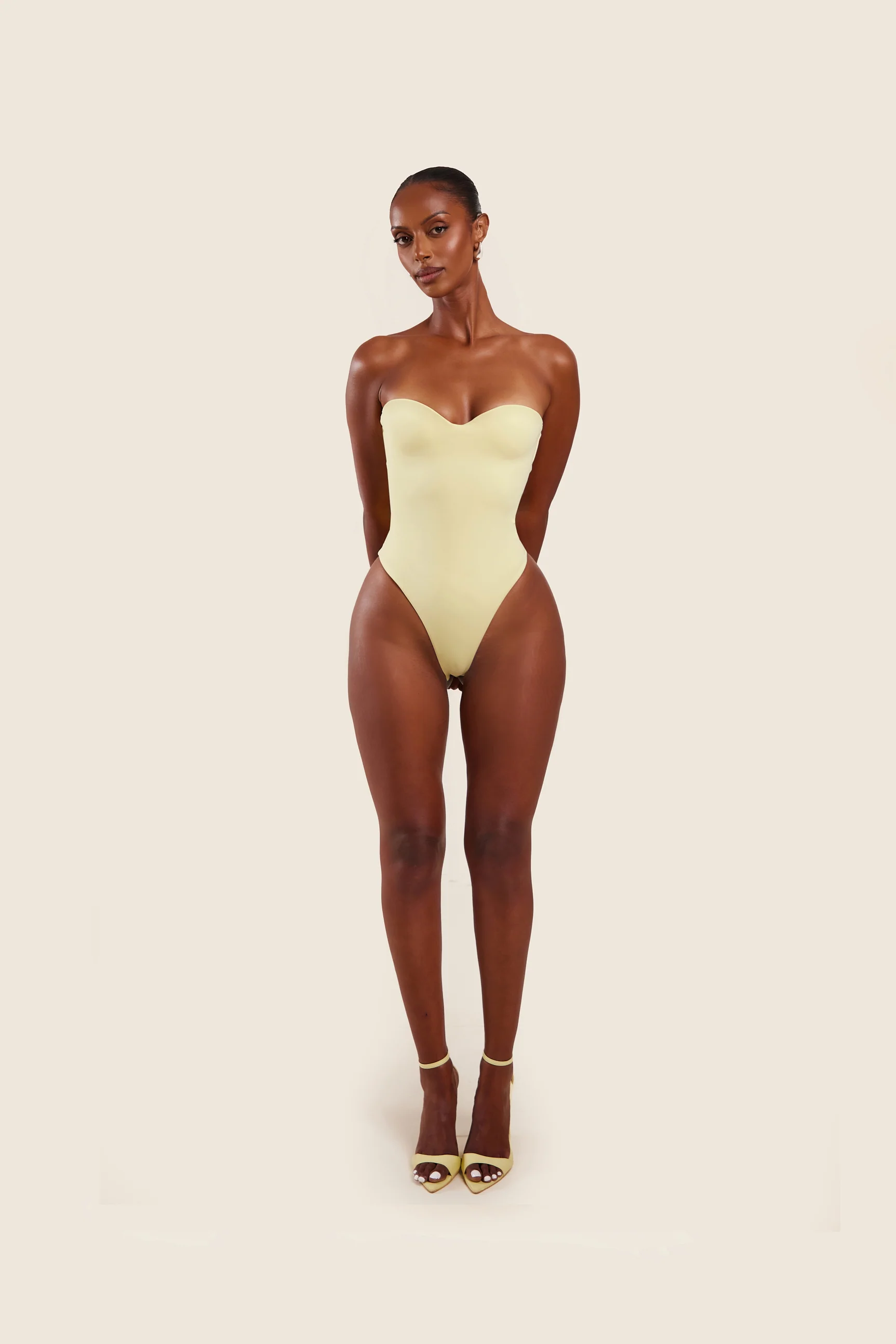 The Sculpt Bodysuit in Yellow