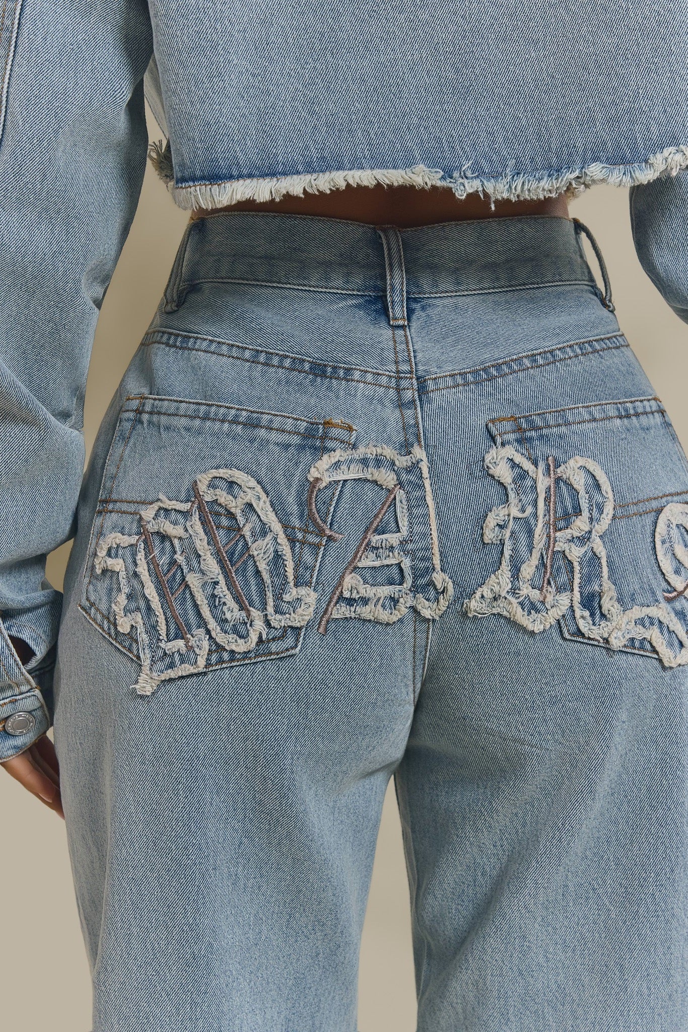 The Kali Mid-Rise Jeans in Light Wash Blue