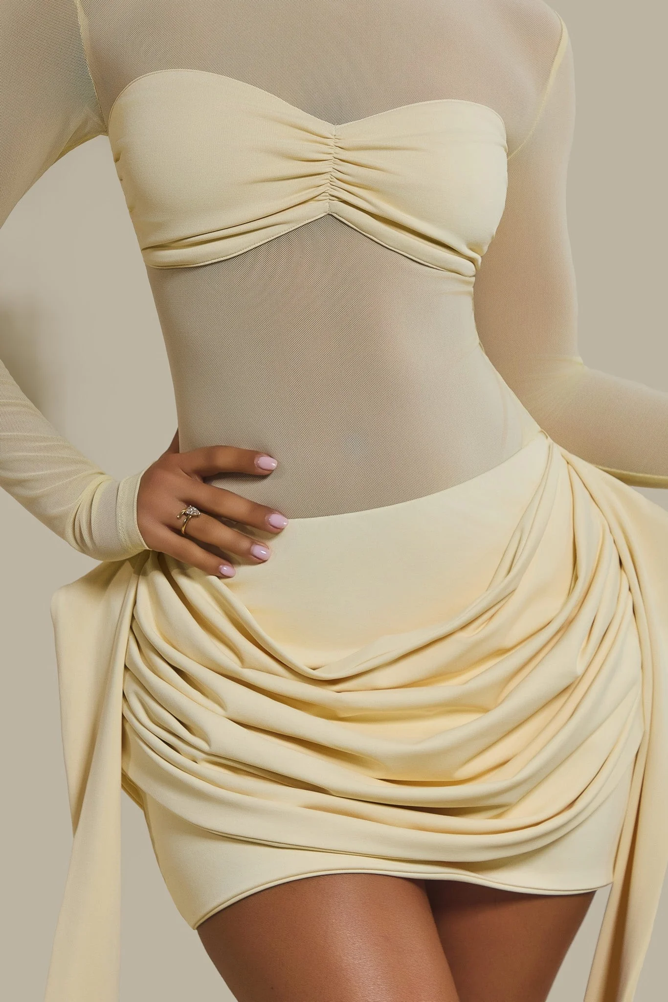 The Yara Long Sleeve Mesh Bodysuit in Butter Yellow
