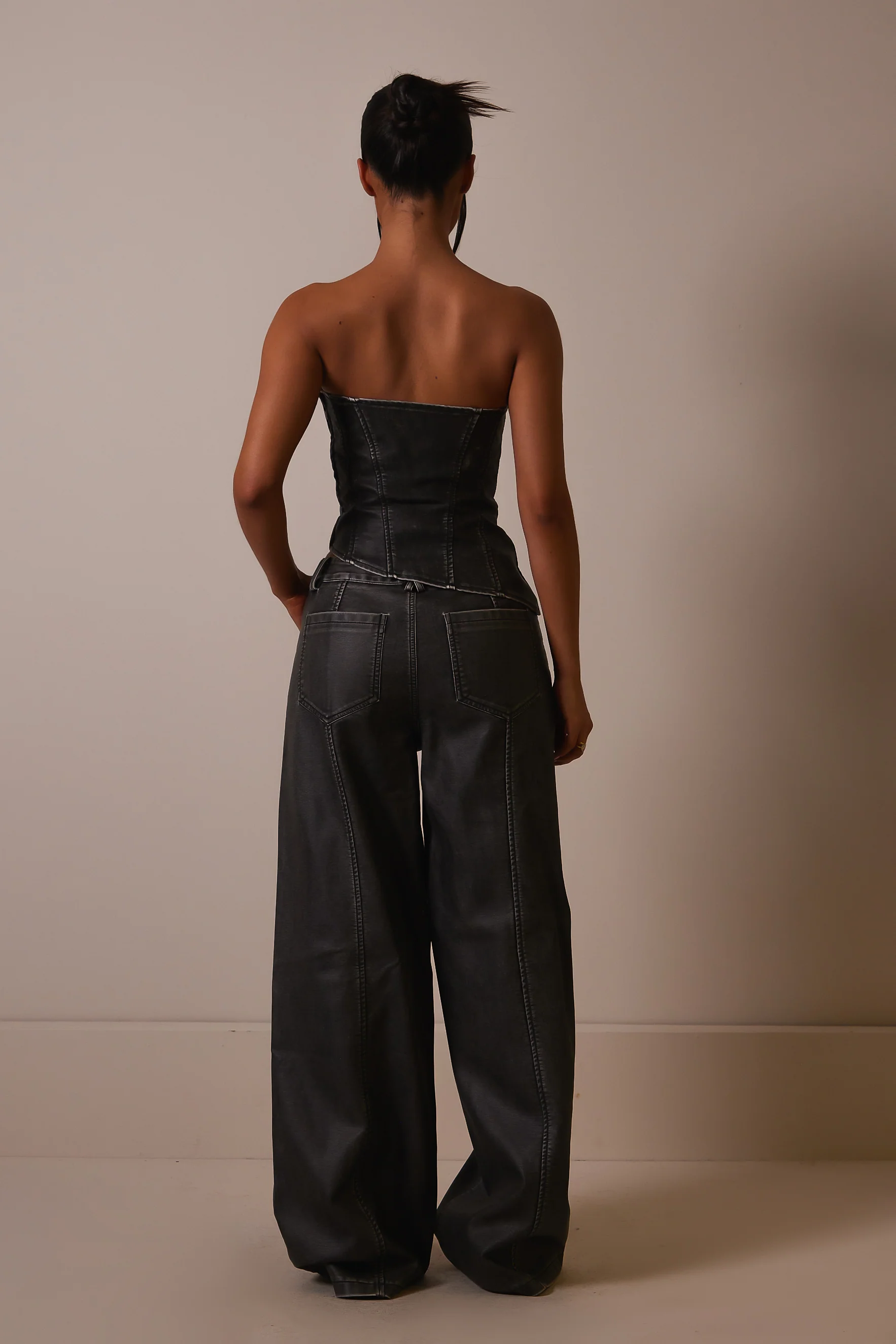 The Distress Wash Asymmetric Leather Corset in Dark Wash
