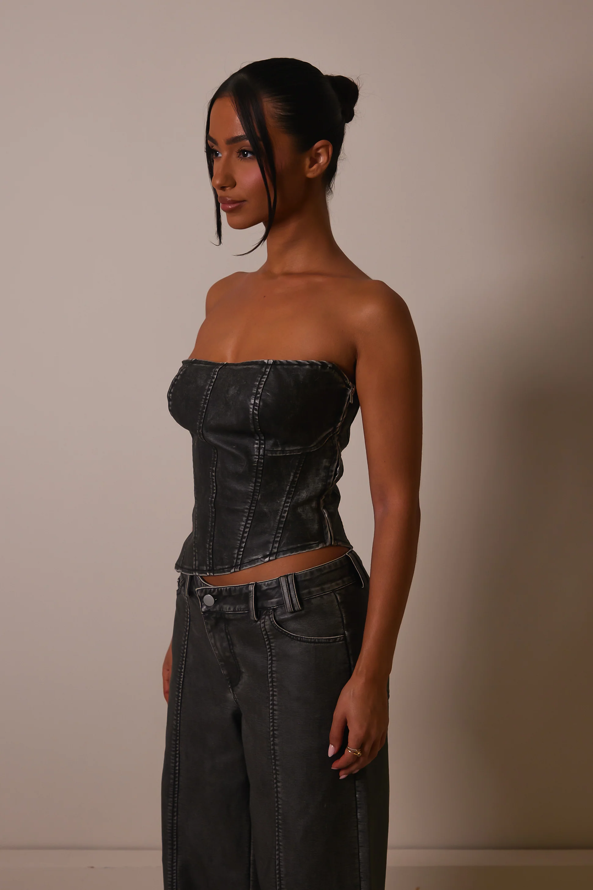 The Distress Wash Asymmetric Leather Corset in Dark Wash