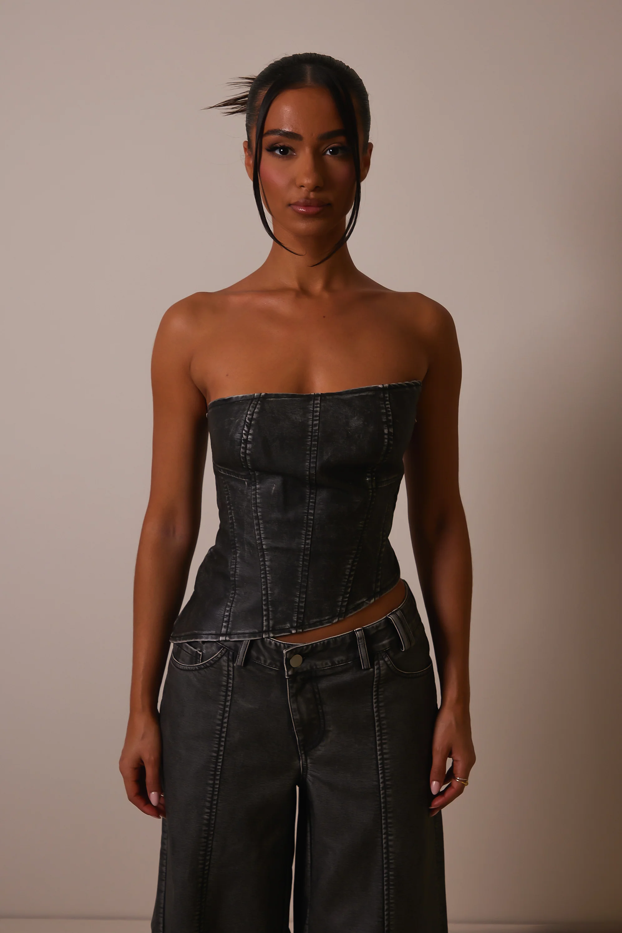 The Distress Wash Asymmetric Leather Corset in Dark Wash
