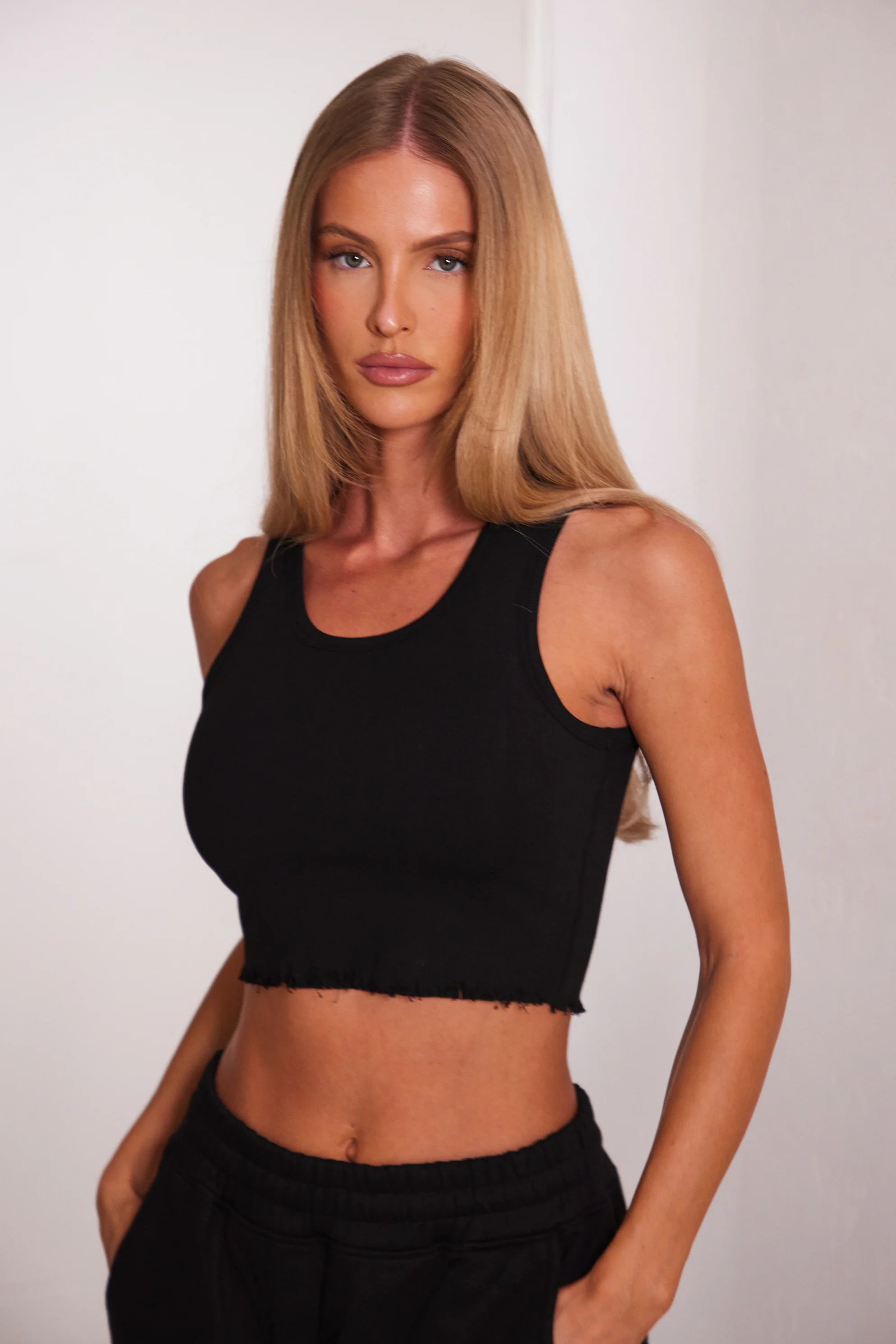 8392-the-distress-hem-vest-in-black-1.webp The Distress Hem Vest in Black