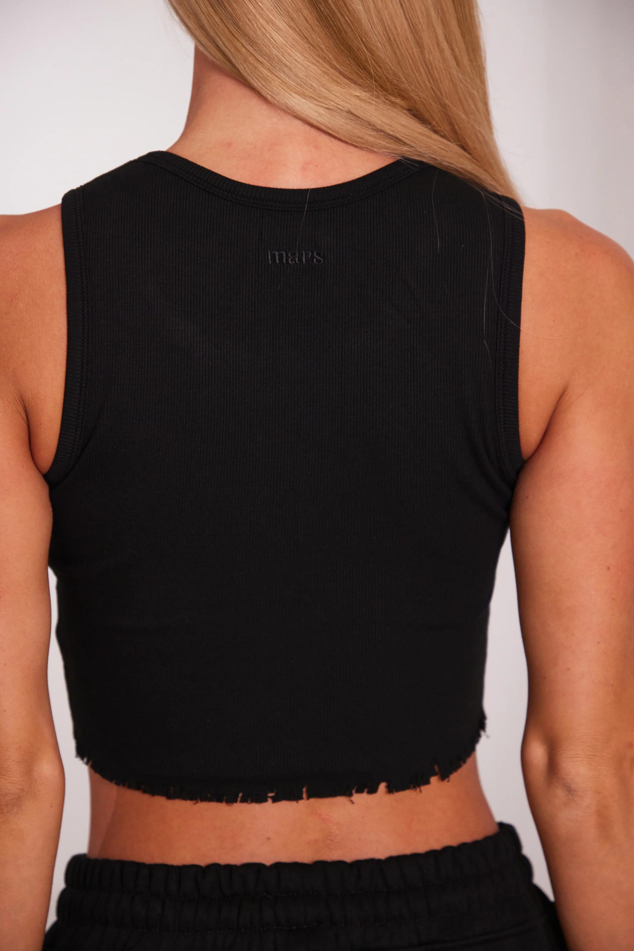 8392-the-distress-hem-vest-in-black-6.webp The Distress Hem Vest in Black