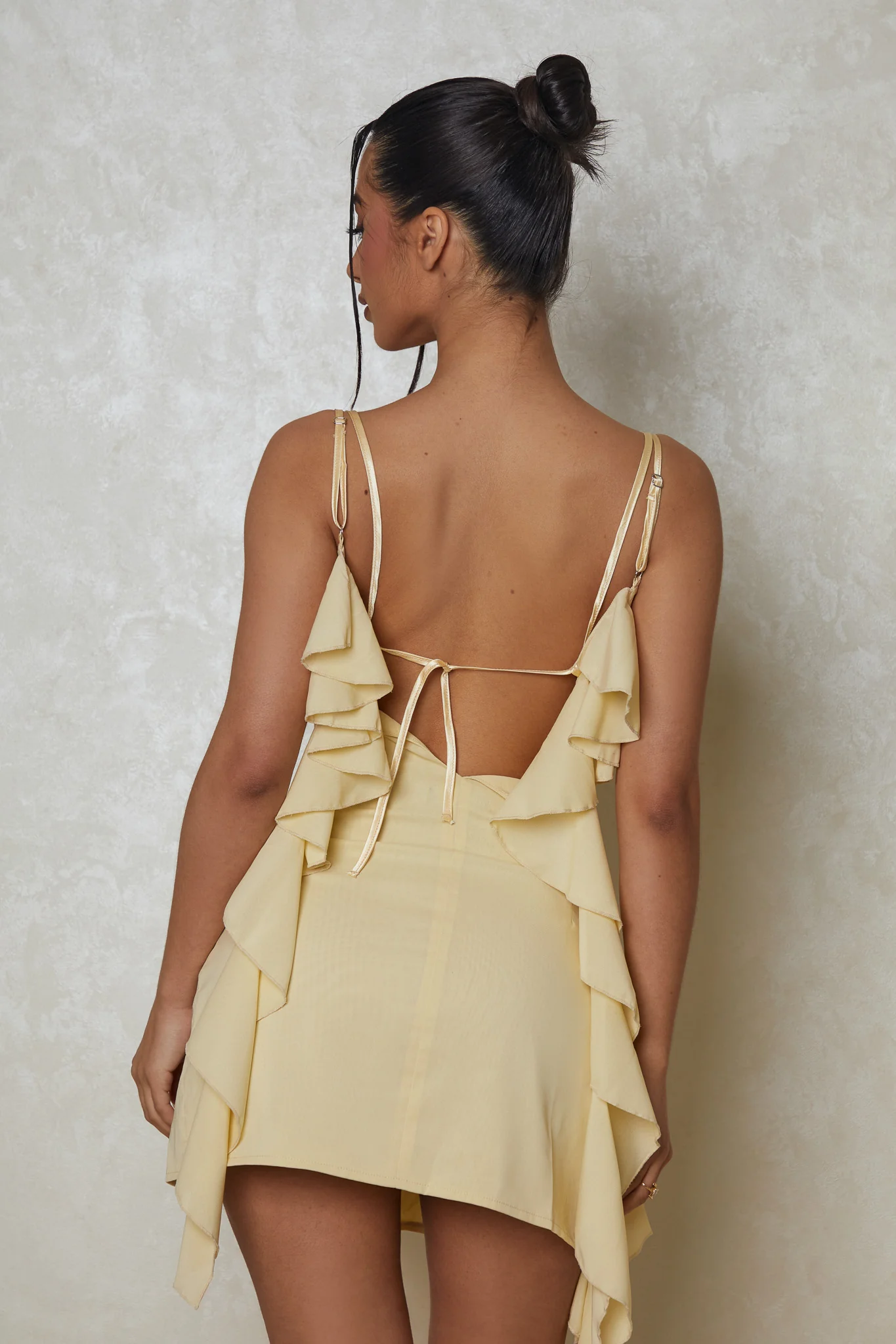 8593-the-cowl-neck-ruffle-mini-dress-in-yellow-3.webp The Cowl Neck Ruffle Mini Dress in Yellow