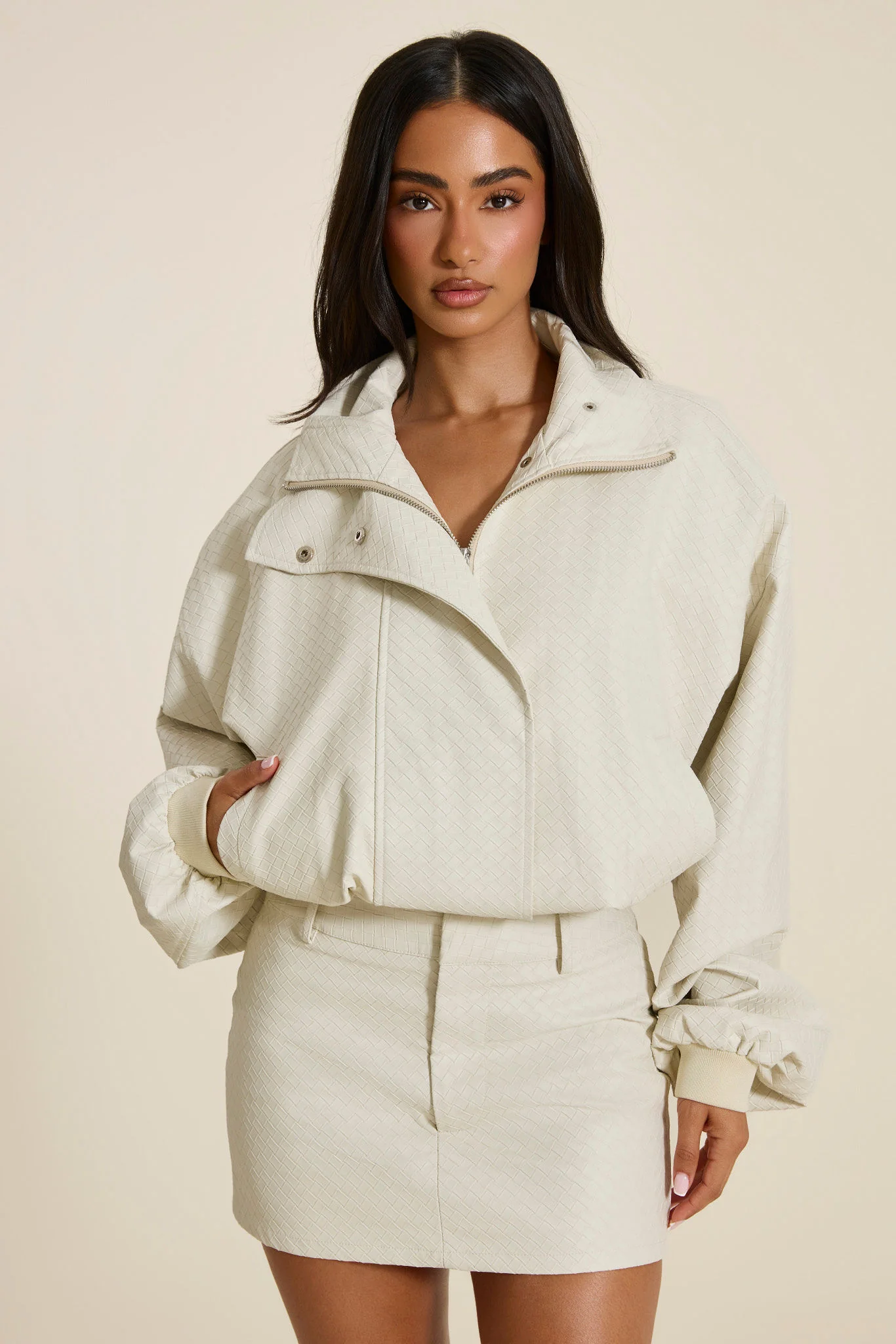 The Nyra Faux Leather Mini Skirt in Off White